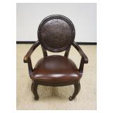 1172	LEATHER ARM CHAIR WITH WEB CUT OUT DESIGN IN BACK