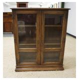 1194	OAK DOUBLE GLASS DOOR BOOK SHELF WITH 2 ADJUSTABLE SHELVES, APPROXIMATELY 26 IN X 13 IN X 44 IN