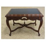 1221	CARVED WALNUT STAND WITH INSET BLACK GLASS TOP, APPROXIMATELY 25 IN X 16 IN X 19 IN H