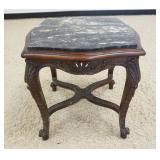 1223	CARVED WALNUT STAND WITH INSET MARBLE TOP, MARBLE HAS CRACK, APPROXIMATELY 21 IN X 21 IN H