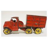 1111	ANTIQUE CAR IRON TOY TRUCK & TRAILER, APPROXIMATELY 2 IN X 7 IN X 3 IN HIGH
