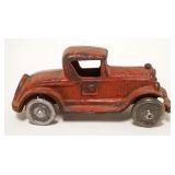 1122	ANTIQUE CAST IRON TOY CAR, APPROXIMATELY 2 IN X 5 IN X  2 IN HIGH