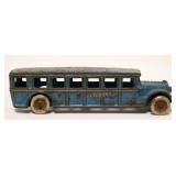 1125	ANTIQUE CAST IRON ARCADE FUGEOL SAFETY COACH TOY BUS, APPROXIMATELY 2 IN X 8 IN X 2 1/4 IN HIGH