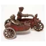 1128	ANTIQUE CAST IRON TOY MOTORCYLE W/SIDE CAR, APPROXIMATELY 5 IN X 3 IN HIGH