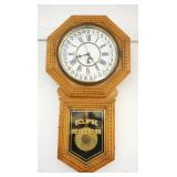 1022	ANTIQUE ECLIPSE CALENDAR REGULATOR WALL CLOCK IN PRESSED OAK CASE, APPROXIMATELY 17 IN WIDE X 3