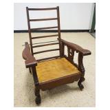 1073	VICTORIAN OAK CANE SEAT WHEEL CHAIR, WOOD WAGON WHEELS, PRESSED BACK DESIGN ON CREST W/BENTWOOD