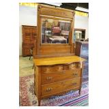 1075	SOLID OAK SERPENTINE FRONT CHEST W/MIRROR TOP & 4 DRAWERS, MIRROR HAS CRACK, APPROXIMATELY 42 I