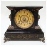 1153	ANSONIA VICTORIAN MANTLE CLOCK IN CAST IRON CASE, APPROXIMATELY 6 IN X 13 IN X 10 1/2 IN HIGH