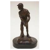 1190	BRONZE STATUE ON WOOD BASE OF MAN HOLDING BALL, APPROXIMATELY 10 IN HIGH