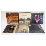 1024	LOT OF GEORGE HARRISON VINYL ALBUMS INCLUDES ALL THINGS MUST PASS, DARKHORSE, LIVING IN THE MAT