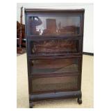 1078	MAHOGANY EMPIRE STYLE 4 SECTION BARRISTER BOOKCASE W/DRAWER & SCROLLED FEET AT BASE, APPROXIMAT