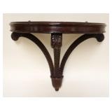 1131	CARVED WALNUT DEMILUNE WALL SHELF W/SCROLLED PLUME SUPPORTS, APPROXIMATELY 13 IN X 23 IN X 21 I