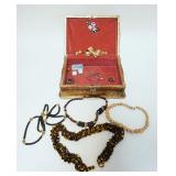 1142	GILT DECORATED WOOD JEWELRY BOX W/COSTUME JEWELRY, BOX APPROXIMATELY 8 IN X 10 1/2 IN X 4 IN HI