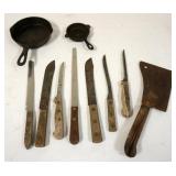 1252	LOT BUTCHER KNIVES, MEAT CLEAVER & CAST IRON PANS