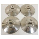 1257	LOT OF 4 VINTAGE HUBCAPS