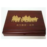 1097	ASIAN GILT METAL TABLETS IN WOOD BOX