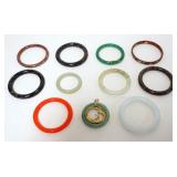 1110	LOT OF 11 JADE RINGS & BRACELETS, LARGEST APPROXIMATELY 3 IN OUTSIDE DIAMETER