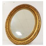 1152	OVAL MIRROR IN GILT FINISHED FRAME, APPROXIMATELY 31 IN X 37 IN