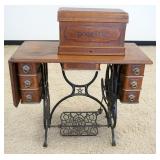1187	ANTIQUE OAK DOMESTIC TREDLE SEWING MACHINE, APPROXIMATELY 35 IN X 17 IN X 39 IN HIGH