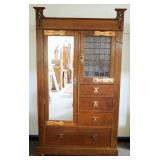 1208	ARTS & CRAFTS STYLE WARDROBE, 2 DOOR, 4 DRAWER, LEAD GLASS DOOR W/ONE CRACKED PANEL, UNIT ALTER