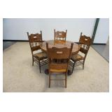1248	ANTIQUE ROUND OAK CLAW FOOT TABLE W/4 PRESSED BACK CHAIRS, TABLE APPROXIMATELY 42 IN X 30 IN HI