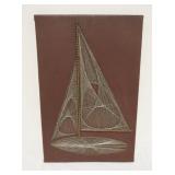 1256	MIDCENTURY MODERN WIRE STRING ART IN THE FORM OF A SAILBOAT ON LEATHER WRAPPED BOARD, APPROXIMA