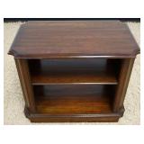 1023	CHERRY CHAIR SIDE STAND WITH CENTER SHELF, APPROXIMATELY 27 IN X 16 IN X 22 IN