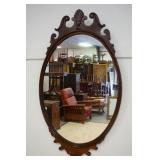 1043	MAHOGANY OVAL MIRROR, APPROXIMATELY 26 IN X 43 IN