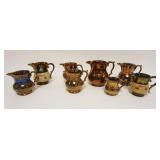 1153	LARGE LOT OF ASSORTED COPPER LUSTER PITCHERS	LARGE LOT OF ASSORTED COPPER LUSTER PITCHERS, LARG