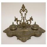 1065	ORNATE VICTORIAN BRASS DOUBLE INKWELL & PEN HOLDER, APPROXIMATELY 13 IN X 10 IN X 9 IN HIGH