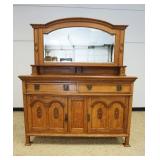 1100	VICTORIAN OAK MIRROR BACK SERVER W/CARVED PANELED DOORS, MISSING PULLS, APPROXIMATELY 60 IN X 2
