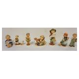 1189	LOT OF 7 HUMMEL FIGURES, LARGEST APPROXIMATELY 6 IN
