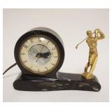 1241	ELECTRIC CLOCK W/FIGURE OF GOLFER, APPROXIMATELY 8 IN X 2 1/2 IN X 5 1/2 IN HIGH