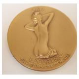 1243	BRONZE COMMEMORATIVE COIN MEDDALIC ART CO NY OF NUDE WOMAN, APPROXIMATELY 2 1/2 IN