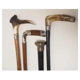 1015	LOT OF 4 ASSORTED ANTIQUE CANES/WALKING STICKS SOME W/STAG HANDLES & METAL BANDS, TALLEST APPRO