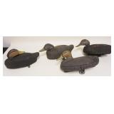 1073	LOT OF 4 CORK BODY DUCK DECOYS, LARGEST APPROXIMATELY 15 IN X 8 IN X 6 IN