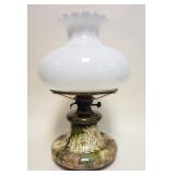 1104	ANTIQUE ART POTTERY KEROSENE LAMP, APPROXIMATELY 22 IN H, LAMP HAS BEEN ELECTRIFIED