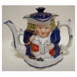 1108	ANTIQUE STAFFORDSHIRE TOBY TEA POT WITH LID APPROXIMATELY 8 IN H