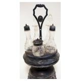 1132	VICTORIAN CASTOR SET IN SILVER PLATE REVOLVING HOLDER, APPROXIMATELY 15 IN H, 1 BOTTLE NECK CRA