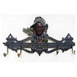 1135	CAST METAL BLACK MEMORBILIA COAT RACK, CENTER HOOK MISSING, APPROXIMATEY 13 IN X 7 IN