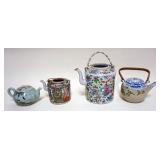 1153	GROUP OF 4 ASIAN TEA POTS, TALLEST APPROXIMATELY 7 IN H