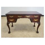 1208	MAHOGANY DESK WITH 4 DRAWERS ON CABRIOLE BALL AND CLAW FOOT LEGS AND REEDED QUARTER COLUMN SIDE