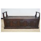 1212	ANTIQUECONTENTIAL  OAK CARVED LIFT TOP BENCH WITH CARVED FOLDED LINEN PANELS AND DOULPHINS, APP