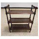 1219	DIMINUATIVE OAK 3 TIER STAND WITH CANE SHELVING, APPROXIMATELY 11 IN X 25 IN X 30 IN