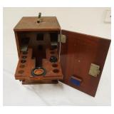 1158	ANTIQUE MAHOGANY MICROSCOPE CASE W/SOME LENSES, LOSS TO LEFT FRONT EDGE OF CASE, APPROXIMATELY 