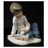 1012	NAO PORCELAIN FIGURINE, BOY PLAYING W/TRAIN, APPROXIMATELY 5 IN HIGH