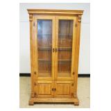 1170	SOLID OAK 4 DOOR CURIO CABINET, 2 GLASS OVER 2 SOLID, HAS HALF REEDED COLUMN SIDES, INTERIOR LI