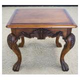 1208	ORNATE CARVED PAW FOOT OCCASSIONAL STAND IN WALNUT FINISH, APPROXIMATELY 28 IN X 23 IN X 26 IN 