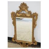 1268	HANGING BEVELED EDGE MIRROR IN ORNATE PIERCED GILT FINISHED FRAME, APPROXIMATELY 23 IN X 39 IN