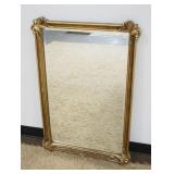 1269	HANGING BEVELED EDGE MIRROR IN GILT FINISHED FRAME, APPROXIMATELY 25 IN X 38 IN